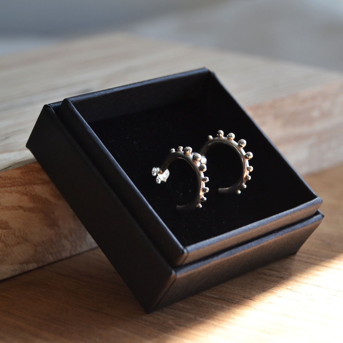 Silver Huggie hoops with granulation details