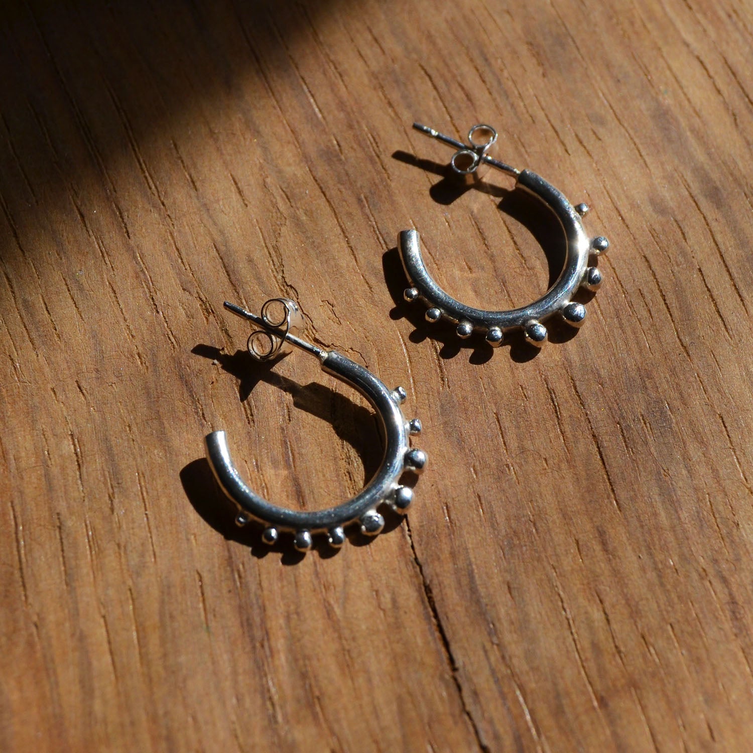 Silver Huggie hoops with granulation details