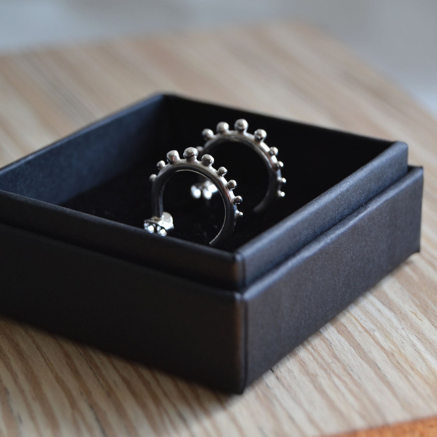 Silver Huggie hoops with granulation details