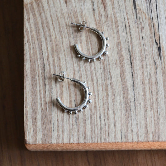 Silver Huggie hoops with granulation details